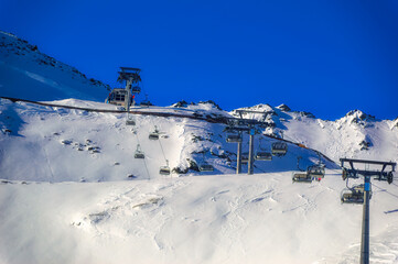 Ski lift at snow covered hills of Soelden, Austria.