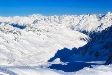 Naklejka premium Austrian Alps covered with snow during sunny winter day.