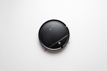 top view of black robot vacuum cleaner isolated, new technology machine