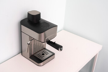 classic metal automatic coffee machine at home on the table