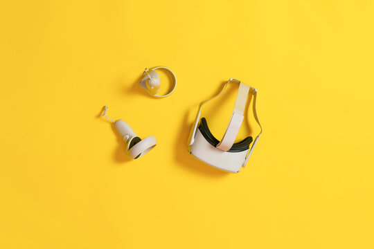 set of virtual reality with headset and controllers flat lay, digital technilogy concept