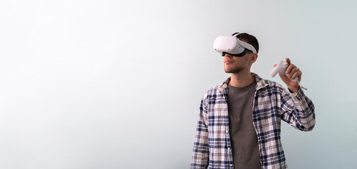 young guy using virtual reality googles, new modern technology headset