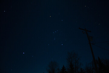 The constellation Orion overhead on a starry night