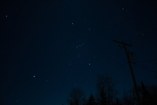 The constellation Orion overhead on a starry night