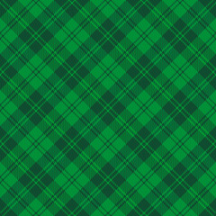 St. Patricks day dioganal tartan plaid. Scottish pattern in green and dark green cage. Scottish cage. Traditional Scottish checkered background. Seamless fabric texture. Vector illustration