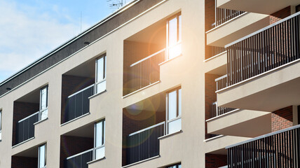 Abstract architecture, fragment of modern urban geometry,. Modern apartment building on a sunny day with a blue sky,. European residential apartment buildings.