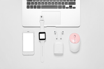 Composition with mobile phone, laptop and modern gadgets on white background