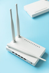 White wi-fi router on color background