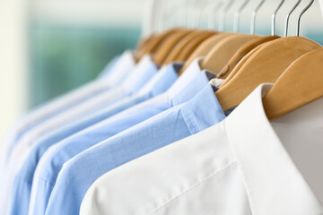 Rack with clean shirts after dry-cleaning