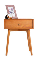 Wooden bedside table with frame and alarm clock on white background