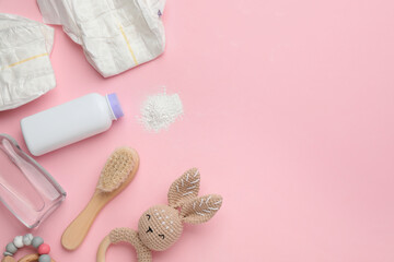 Obraz na płótnie Canvas Flat lay composition with dusting powder and other baby care products on pink background, space for text