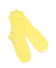 Pair of yellow socks on white background