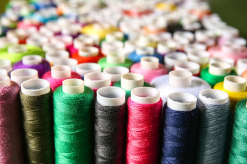 Closeup view of different spools with sewing threads