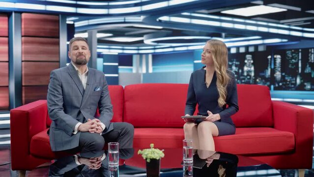 Talk Show TV Program: Two Professional Presenters Talk, Discuss News, Politics, Science, Gossip, Celebrity and Entertainment. Cable Channel Hosts Have Conversation. Playback Mock-up Television Studio