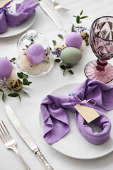 Obraz premium Festive table setting for Easter celebration on light background