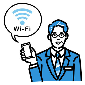 スマートフォンを持ってWi-Fiの説明をしているバッヂのついたスーツを着たメガネをかけた中年男性
