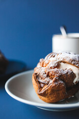 Coffee break with chocolate cream puff and original cream puff