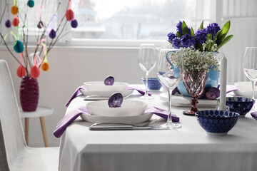 Festive table setting for Easter celebration in light room