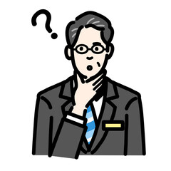 Fototapeta premium 顎に手をあてて考えているバッヂのついたスーツを着たメガネをかけた中年男性 