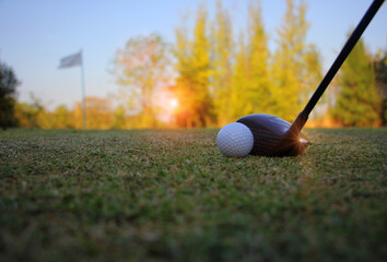Plakat golf balls and Golf equipment are ready to hit the sunlit green lawns in summer.