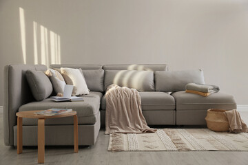 Living room interior with large grey sofa