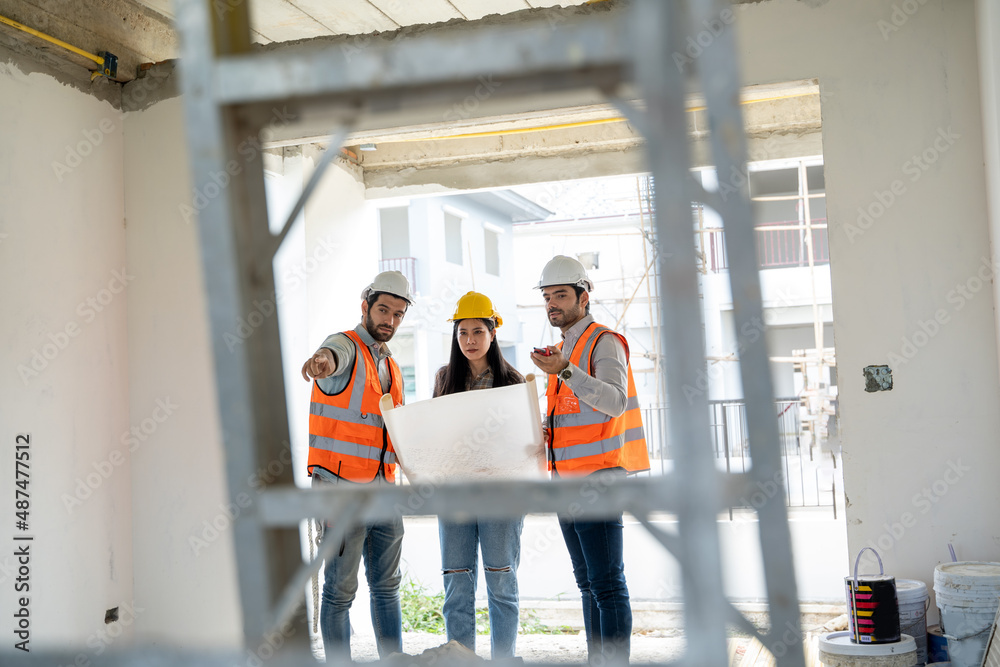 Poster engineer and technician team discussing in new home construction site.,colleagues working together,c