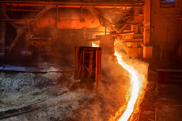 The flow of molten hot metal, molten steel flows along the guide chute. Blast furnace