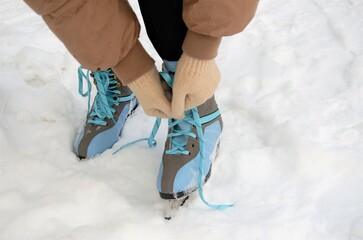 tying shoelaces on skates, the concept of a winter outdoor sport