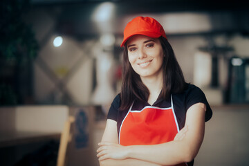 Happy Smiling Fast-Food Worker Standing in a Restaurant