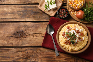 Delicious traditional Ukrainian banosh served on wooden table, flat lay. Space for text