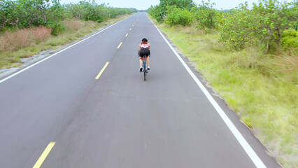 Asian young woman ride bicycle