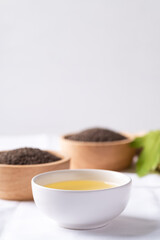 Perilla oil and seeds in bowl on white background, Healthy herbal seed ingredients in Asian food