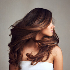 Making hairstory everyday with gorgeous hair. Studio shot of a young beautiful woman with long...