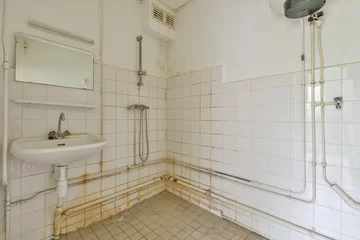 Fotobehang interior of a bathroom in need of repair © Casa imágenes