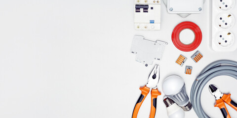 Set of electrician tools and equipment for repair of electricity system. Top view with copy space. Banner.