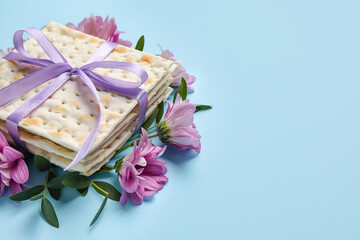 Jewish flatbread with flowers on color background