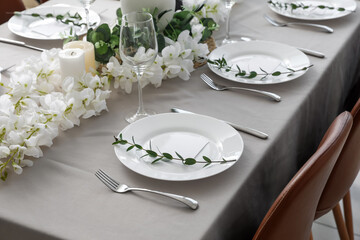 Dining table with beautiful setting and blank cards