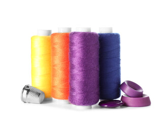 Sewing threads with measuring tape on white background