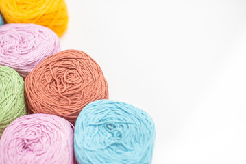 Close Up of yarn balls. Rainbow colors. Yarn for knitting. Skeins of yarn. Knitting needles,...
