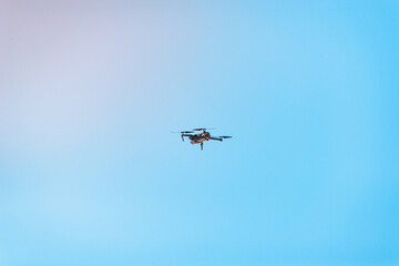 Fototapeta na wymiar Drone in the sky in flight.
