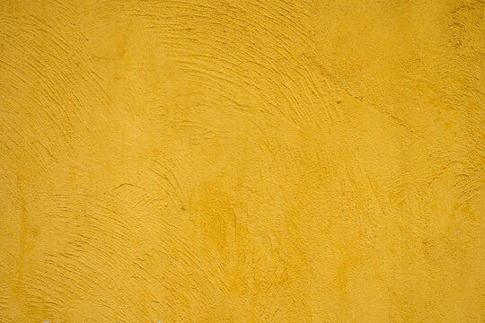 mustard yellow plaster wall texture background