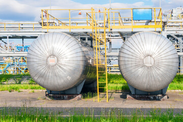 Two gas processing plant tanks .
