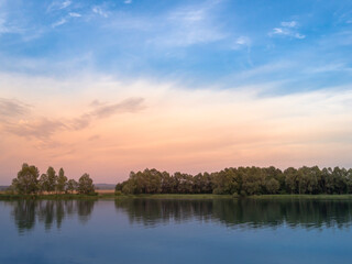 Fototapeta na wymiar A beautiful sunset on a lake or river.
