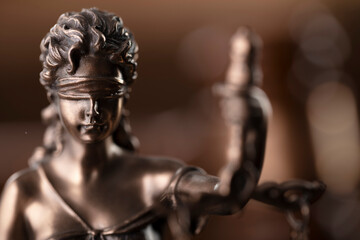 Fototapeta premium Law concept. Law symbols composition: judge’s gavel, Themis sculpture and scale on the brown background.