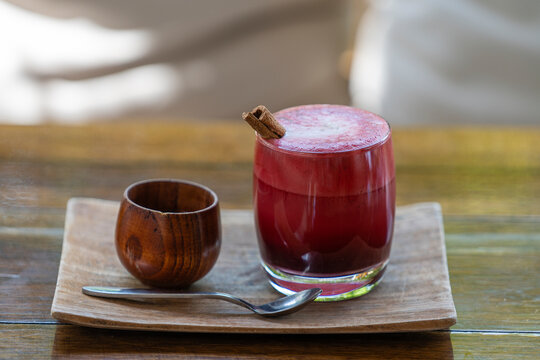 Glass of beetroot vanilla latte from fresh beetroot juice blended with vanilla and coconut milk
