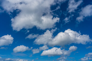 Obraz premium Sunny day, blue sky and white clouds