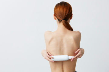 portrait woman lotion jar clean skin health care Gray background