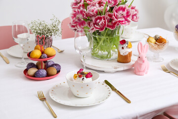 Plate with Easter cake on festive served table