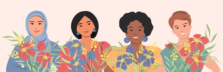 Four lovely women of different nationalities and cultures standing together in spring flowers. The concept for the Mother's day, March 8 women's day, of the female empowerment movement.