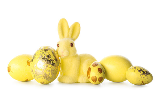 Cute Easter bunny and painted eggs on white background